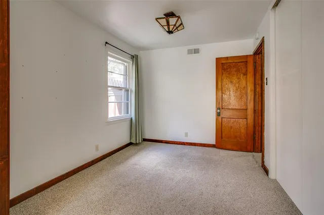 a bathroom with a toilet and shower