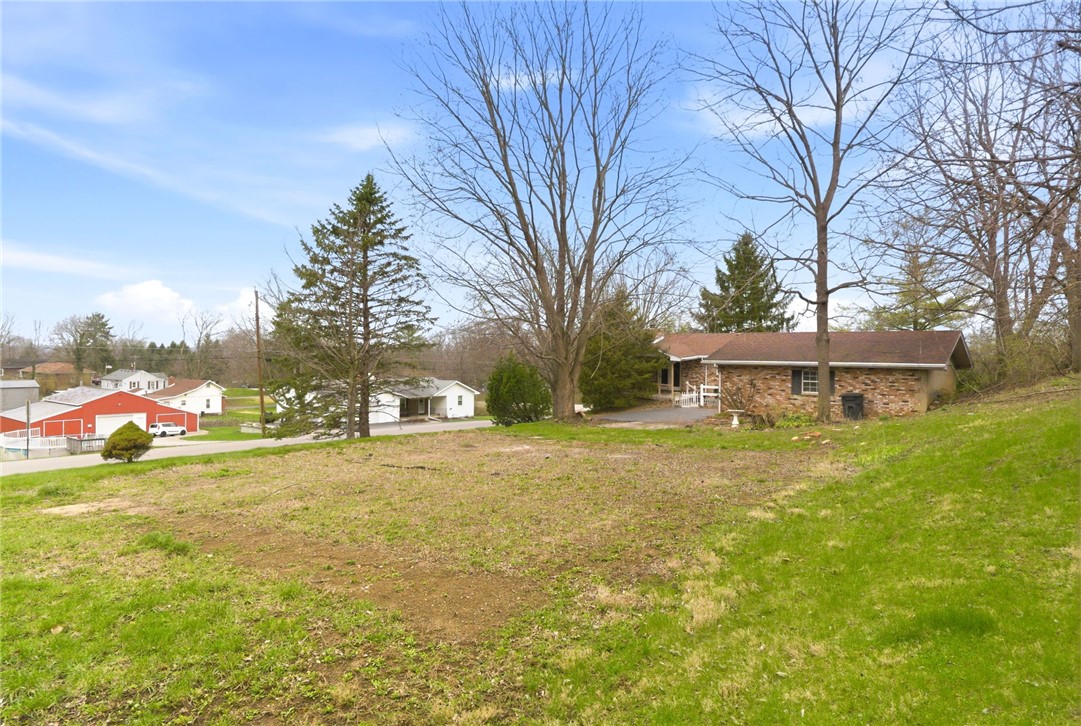 6711 Hamilton-Middletown Road Franklin, OH 45005 - Photo 35 of 49 This charming residence offers a peaceful retreat nestled on a verdant lot.