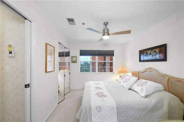 a bedroom with bed and window