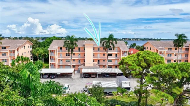 an aerial view of multiple houses with a yard