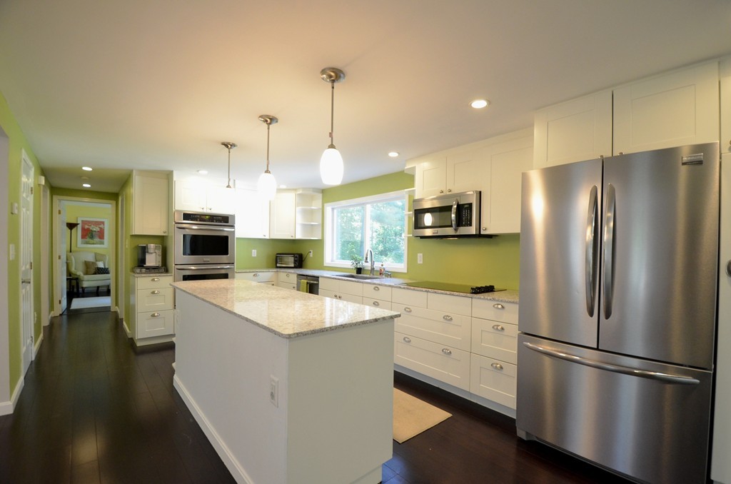 335 Littleton Road Harvard, MA 01451 - Photo 1 of 24 a kitchen with a refrigerator a sink and a stove top oven with wooden floor