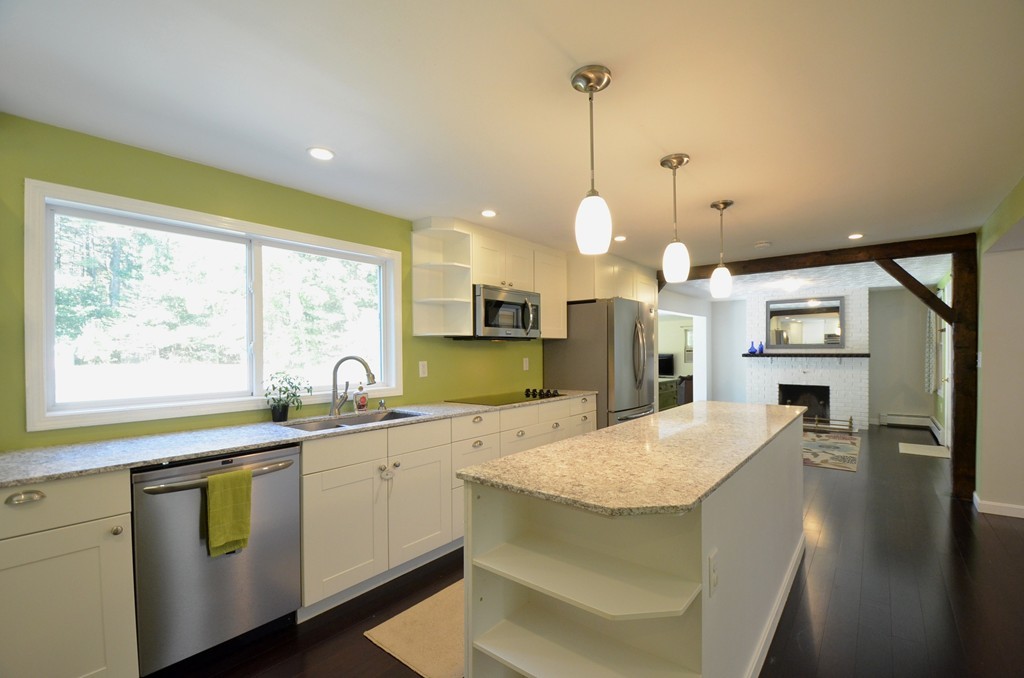335 Littleton Road Harvard, MA 01451 - Photo 2 of 24 a kitchen with a sink a counter top space stainless steel appliances and a large window
