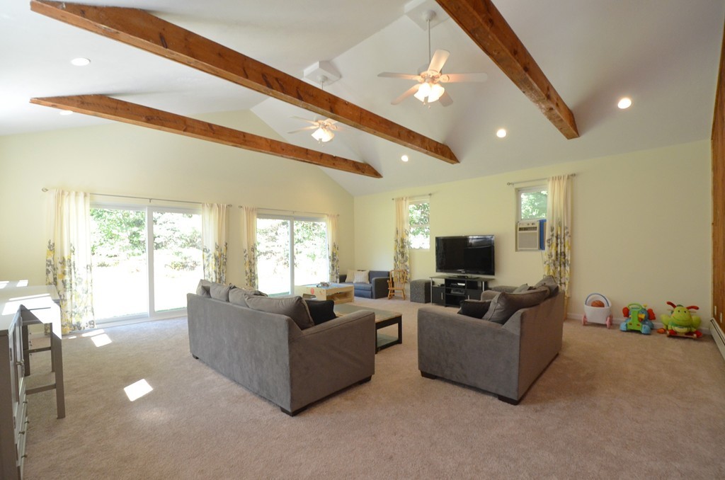 335 Littleton Road Harvard, MA 01451 - Photo 7 of 24 a living room with furniture and a flat screen tv