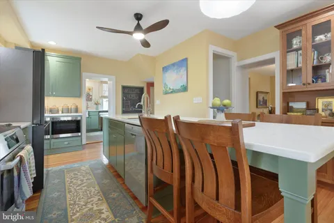 a view of a livingroom with furniture and a kitchen