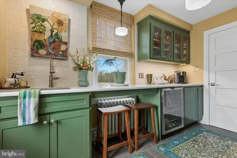 a kitchen that has a sink and a stove in it
