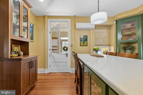 a kitchen with a sink a stove and cabinets