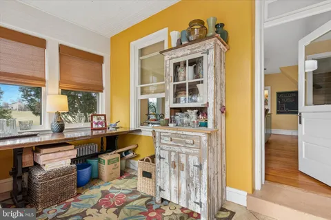 a very nice looking room with a large window and kitchen view