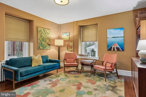 a living room with furniture and a window