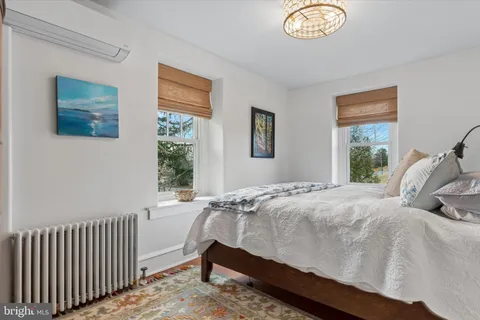 a room with table chairs and a stove
