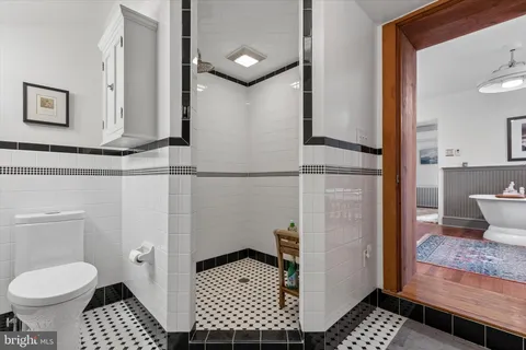 a kitchen with stainless steel appliances kitchen island granite countertop a stove a sink and a refrigerator