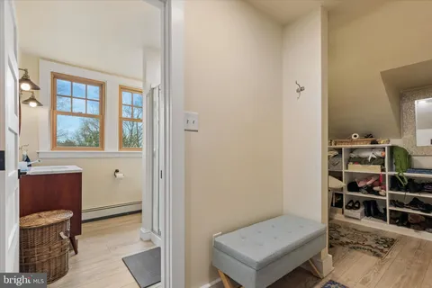 a dining room with furniture and a floor to ceiling window