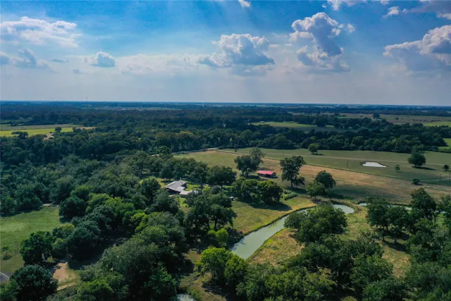a view of lake with green space