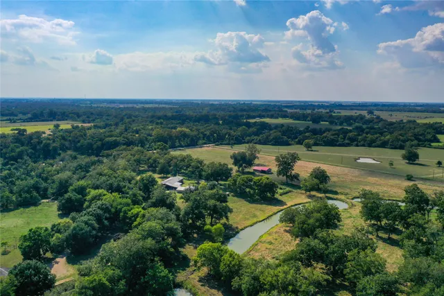 a view of lake with green space