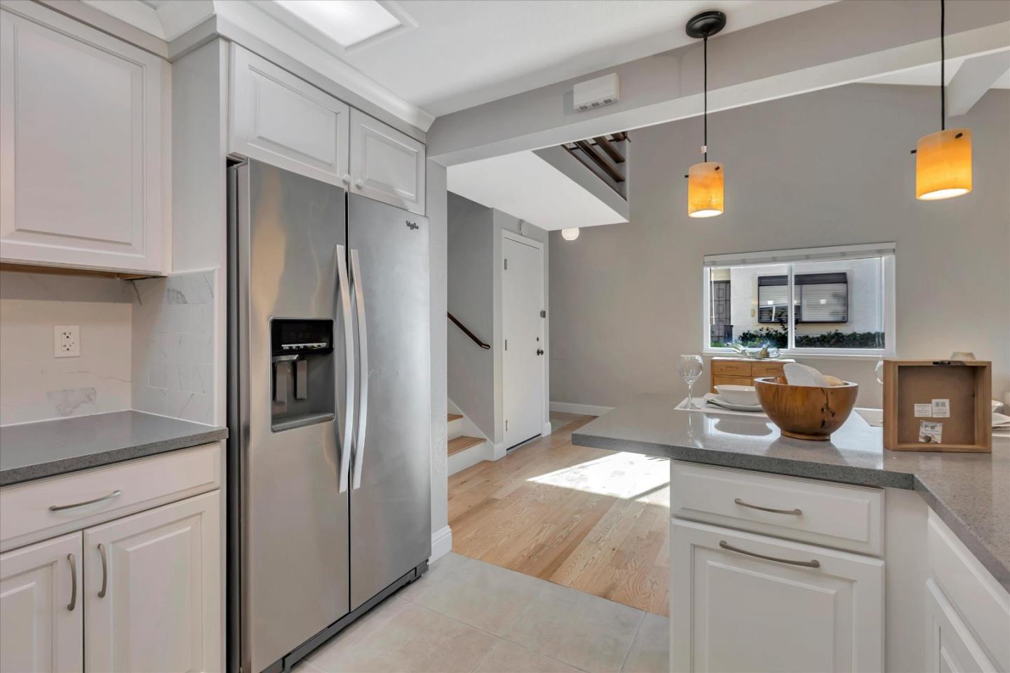 10961 Northsky Square Cupertino, CA 95014 - Photo 11 of 50 a kitchen with stainless steel appliances granite countertop a refrigerator and a sink