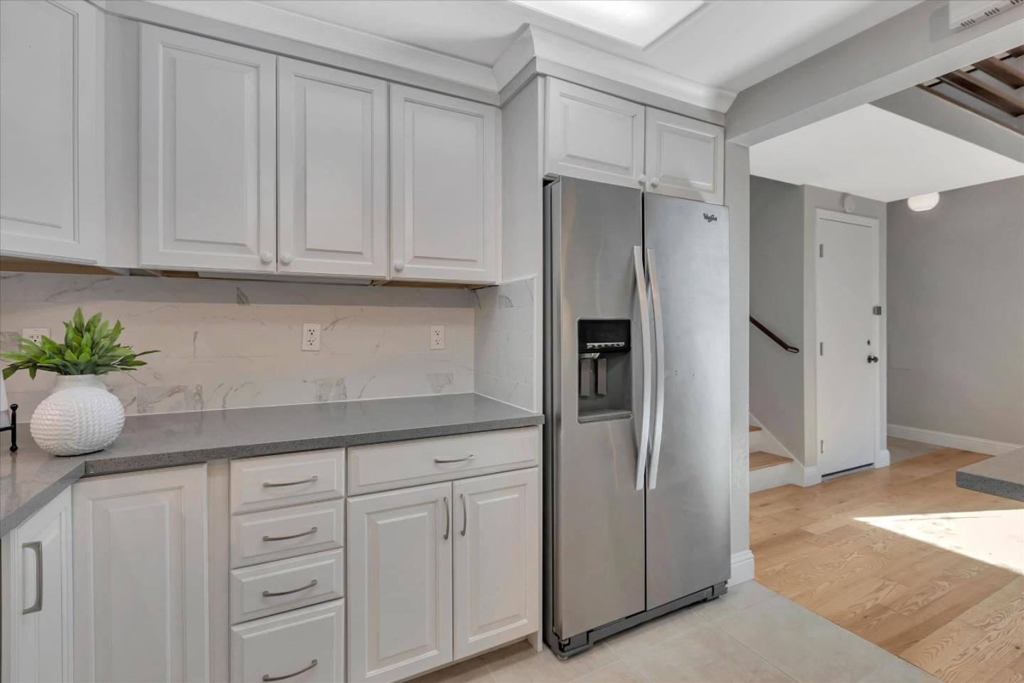 10961 Northsky Square Cupertino, CA 95014 - Photo 12 of 50 a kitchen with appliances cabinets and a counter top space