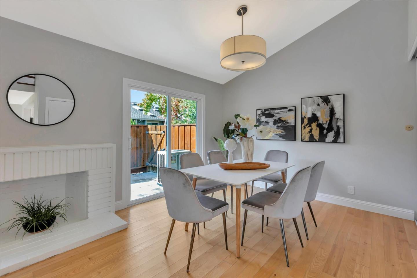 10961 Northsky Square Cupertino, CA 95014 - Photo 15 of 50 a view of a dining room with furniture window and wooden floor