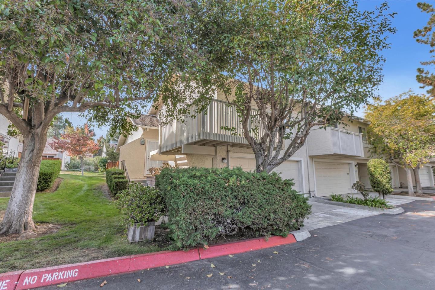 10961 Northsky Square Cupertino, CA 95014 - Photo 2 of 50 a front view of a house with a yard and garage
