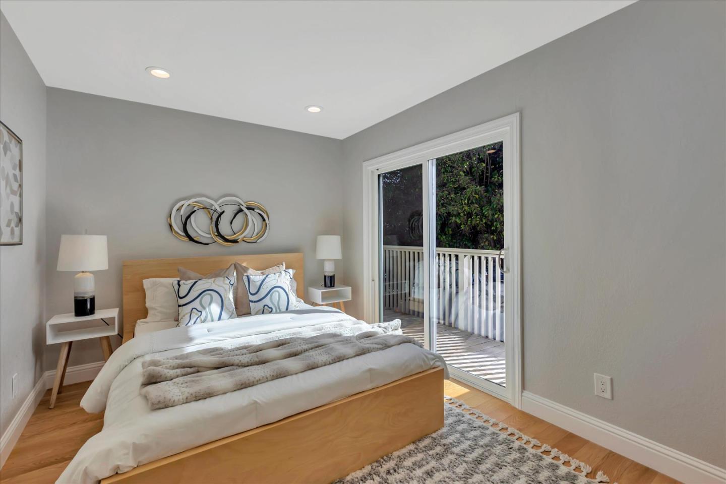 10961 Northsky Square Cupertino, CA 95014 - Photo 21 of 50 a bedroom with a large bed and a window