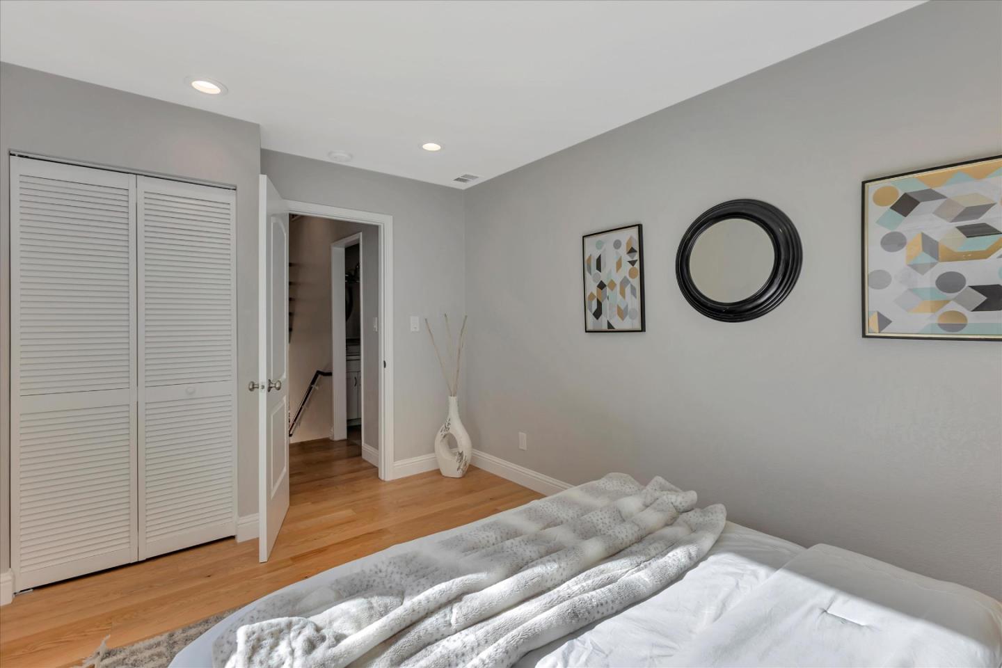 10961 Northsky Square Cupertino, CA 95014 - Photo 22 of 50 a bedroom with a bed and a cabinets