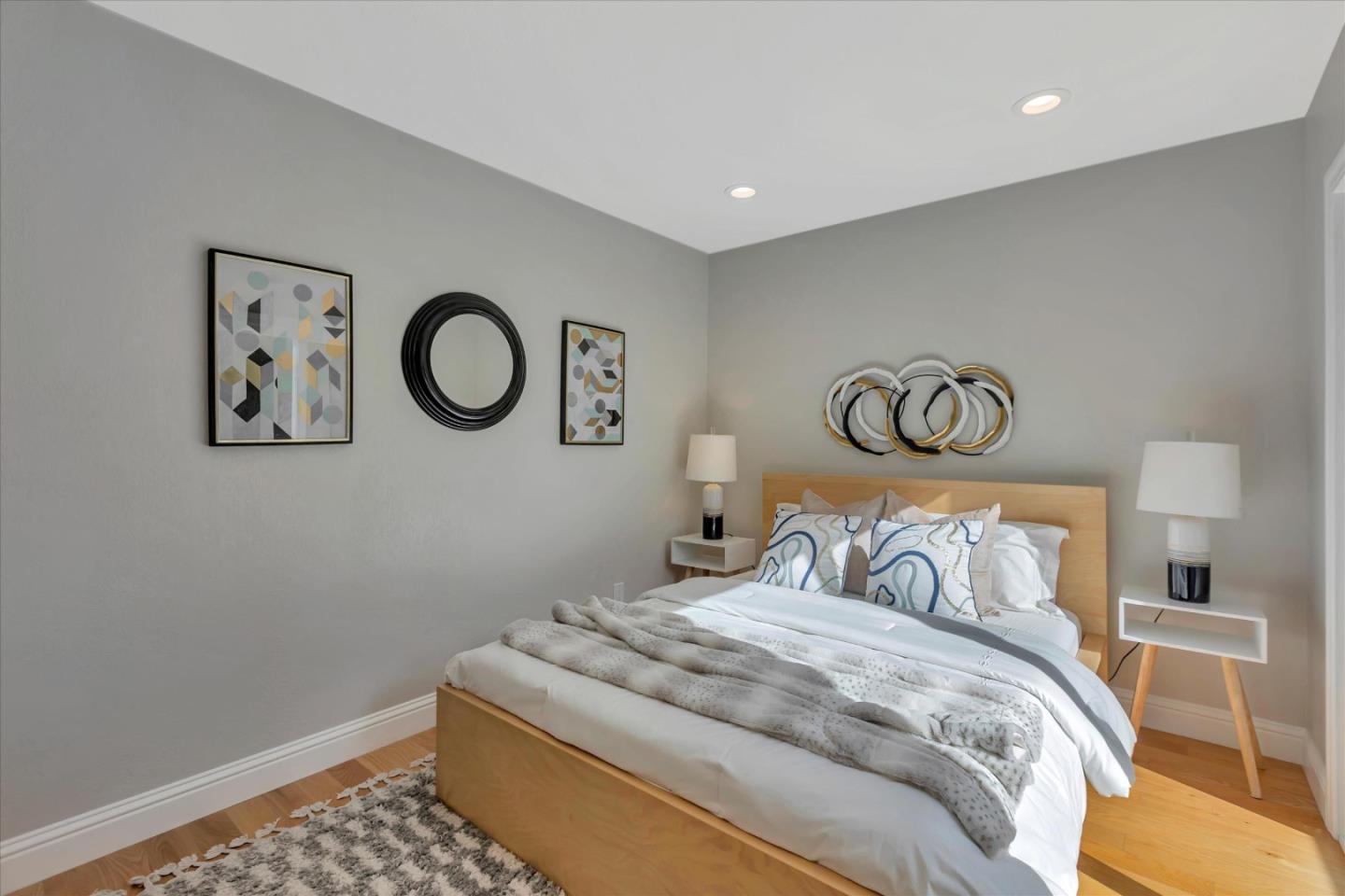 10961 Northsky Square Cupertino, CA 95014 - Photo 23 of 50 a bedroom with a bed and painting on the wall
