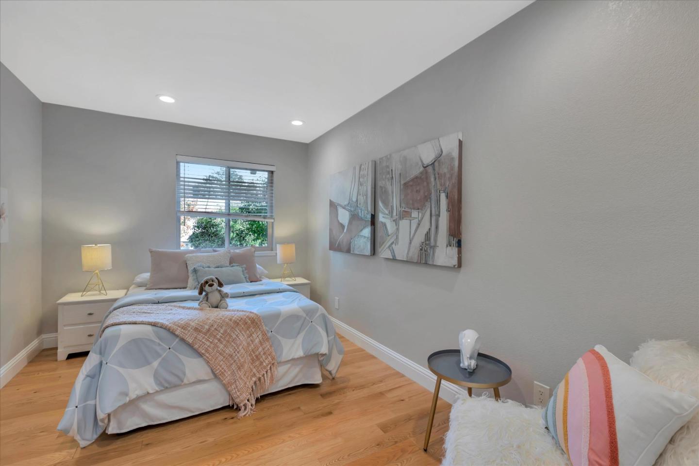 10961 Northsky Square Cupertino, CA 95014 - Photo 24 of 50 a bedroom with a bed and a lamp next to a window