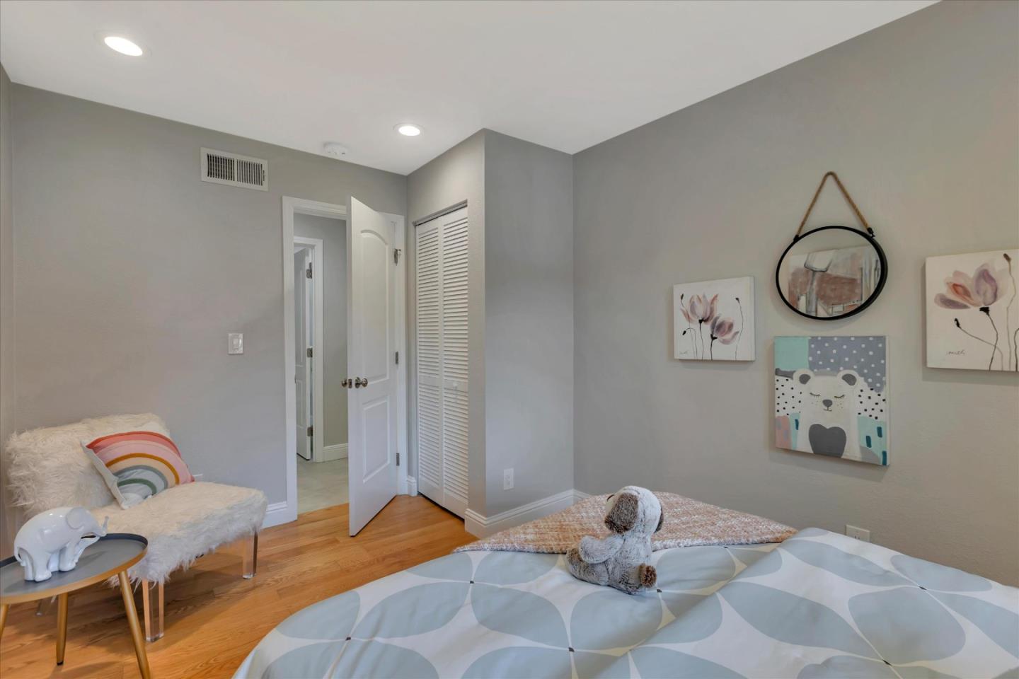 10961 Northsky Square Cupertino, CA 95014 - Photo 25 of 50 a bedroom with a bed and cabinets
