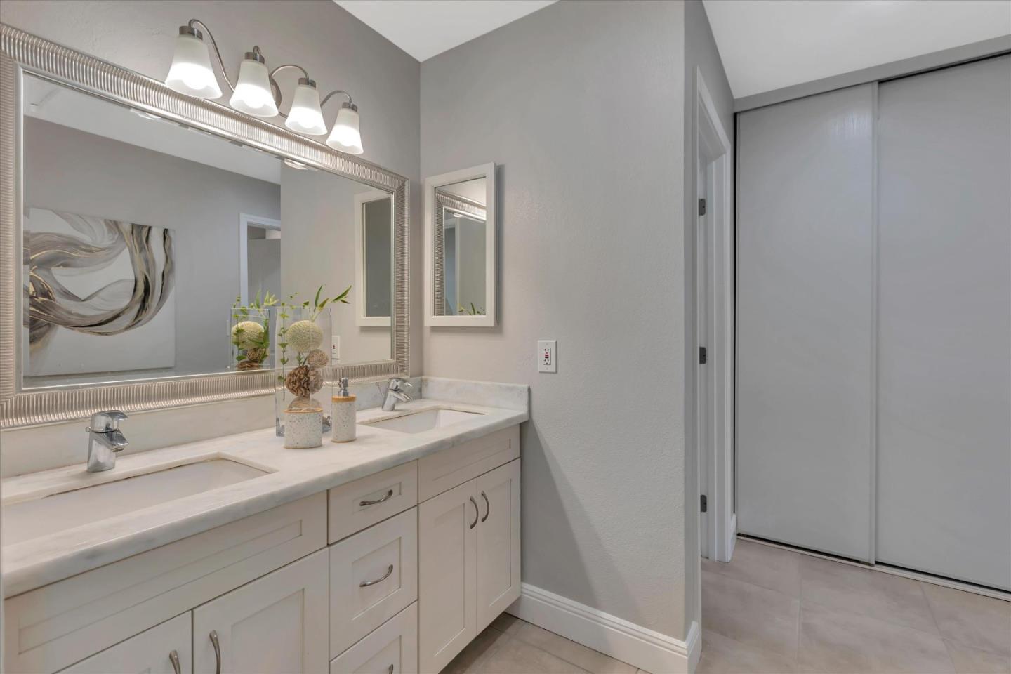 10961 Northsky Square Cupertino, CA 95014 - Photo 28 of 50 a bathroom with double sink and a mirror
