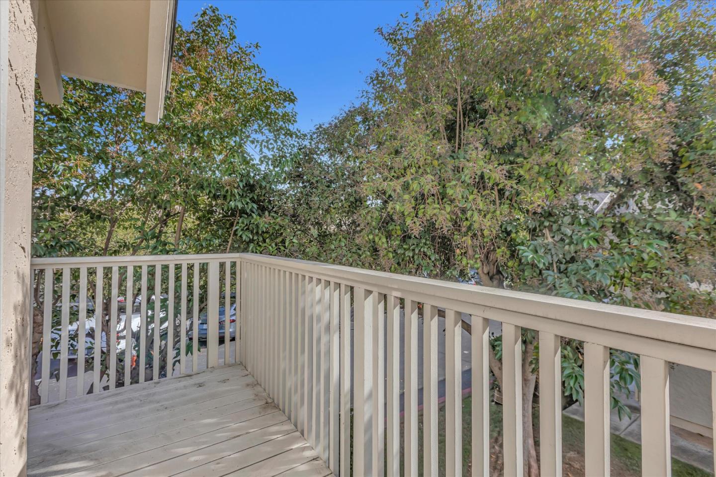 10961 Northsky Square Cupertino, CA 95014 - Photo 30 of 50 a balcony with wooden floor and fence