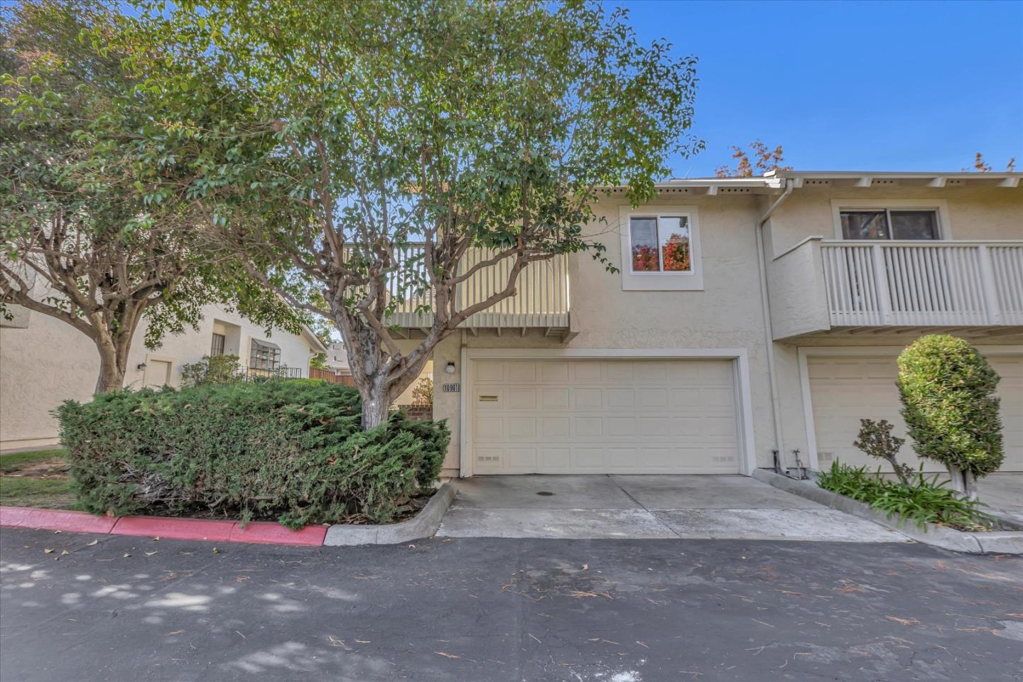 10961 Northsky Square Cupertino, CA 95014 - Photo 3 of 50 a front view of a house with garden
