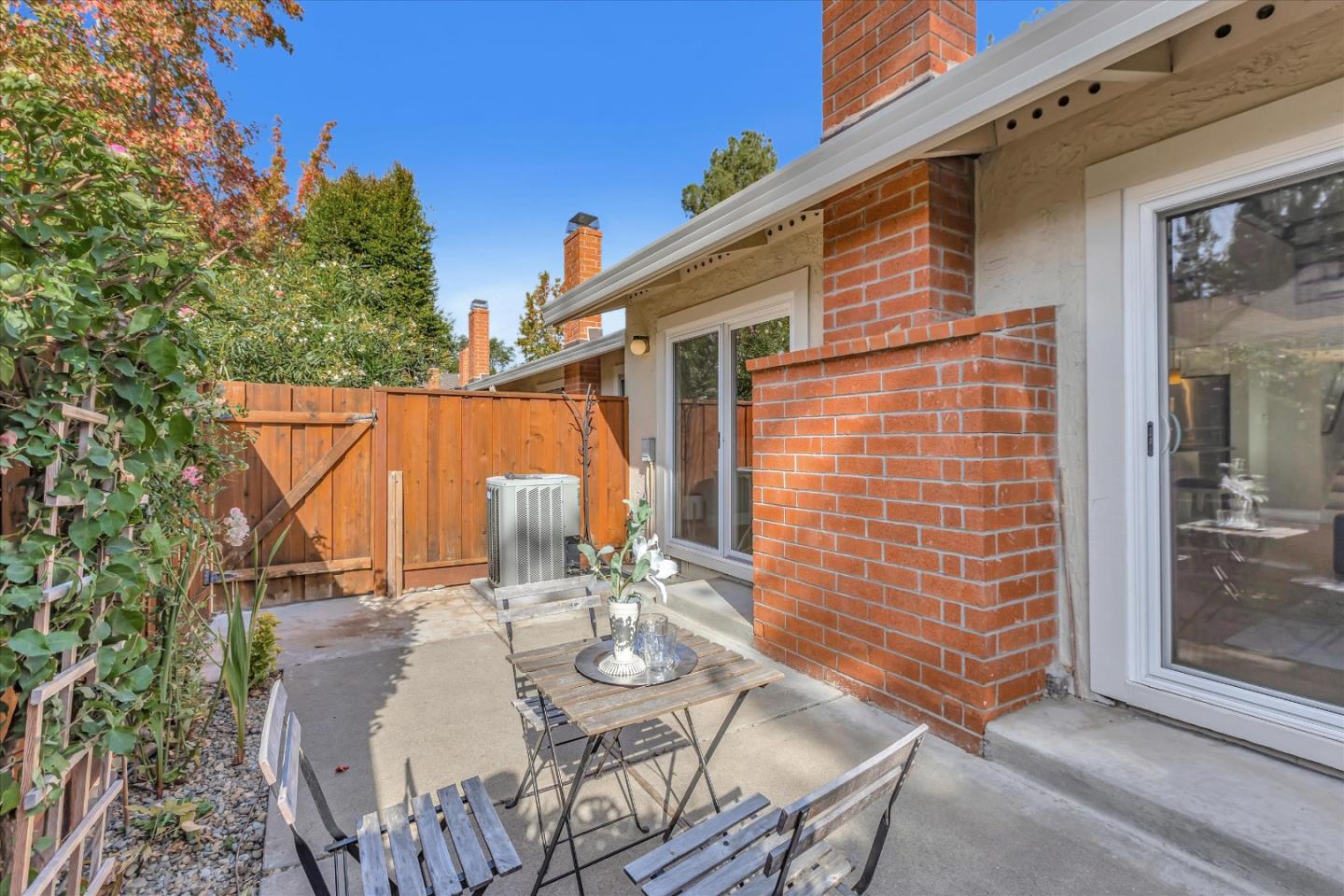 10961 Northsky Square Cupertino, CA 95014 - Photo 35 of 50 a backyard of a house with table and chairs