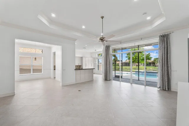a view of an empty room with a sliding door and a window