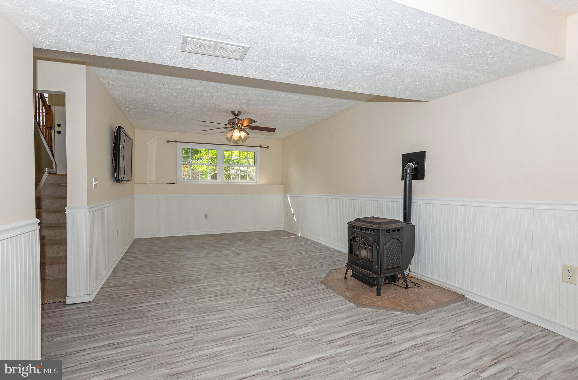 7523 Harmans Road Harmans, MD 21077 - Photo 18 of 27 a view of room with window and hardwood floor