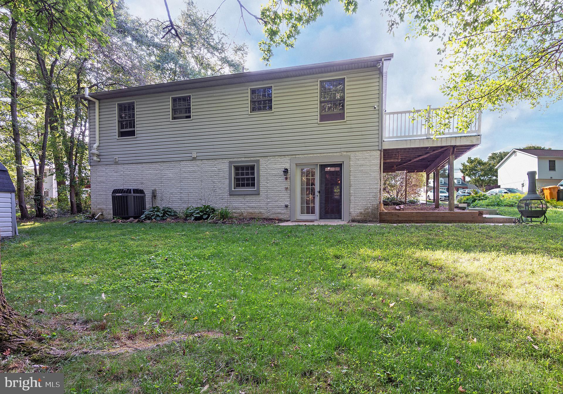 7523 Harmans Road Harmans, MD 21077 - Photo 25 of 27 a front view of house with yard and outdoor seating