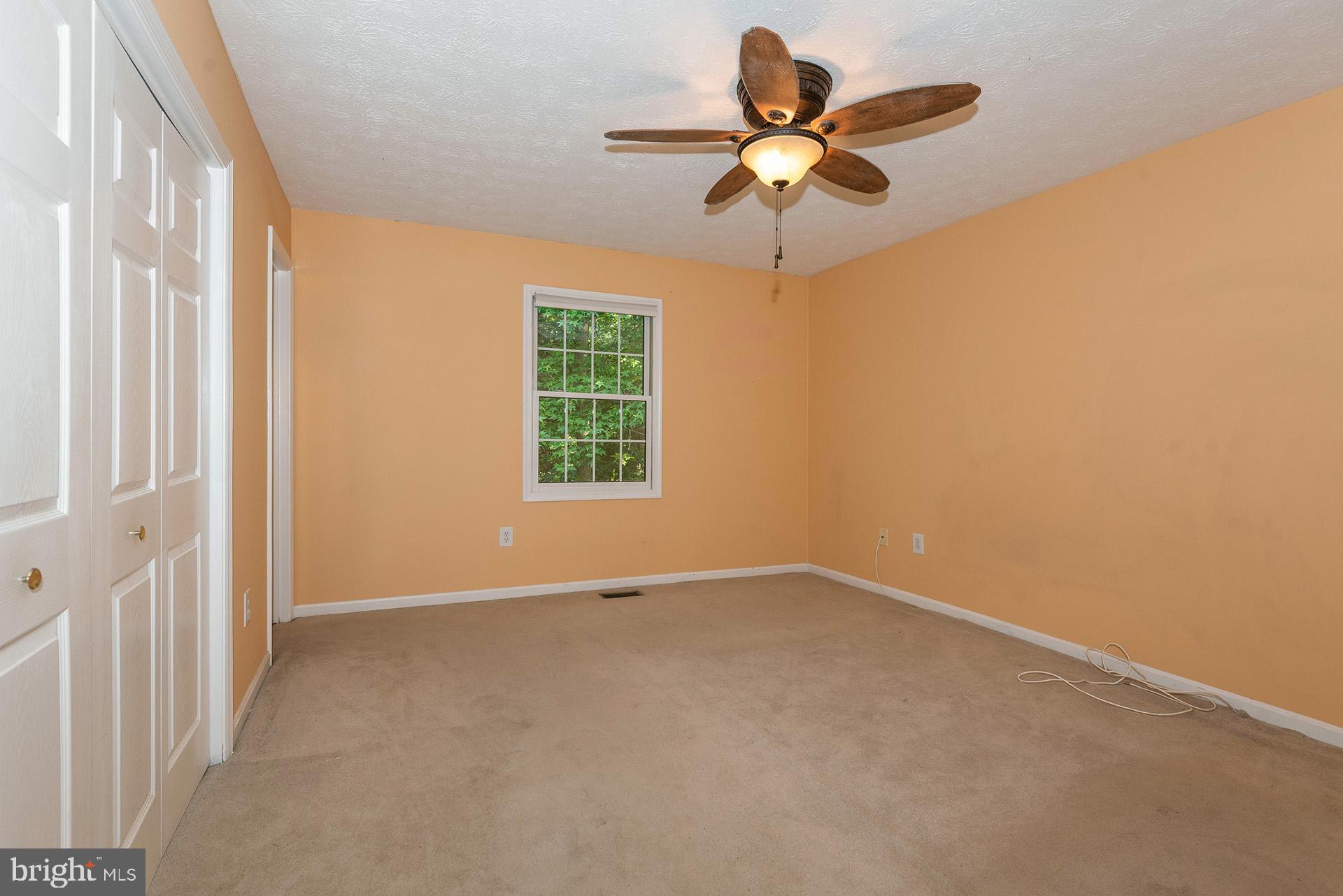 7523 Harmans Road Harmans, MD 21077 - Photo 10 of 27 an empty room with a window and a fan