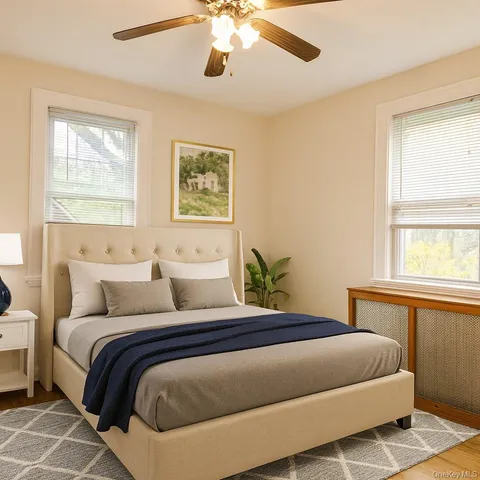 a bedroom with a large bed and a window