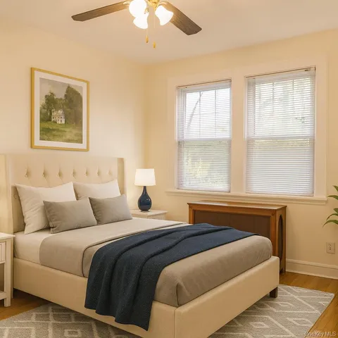 a bedroom with bed and window