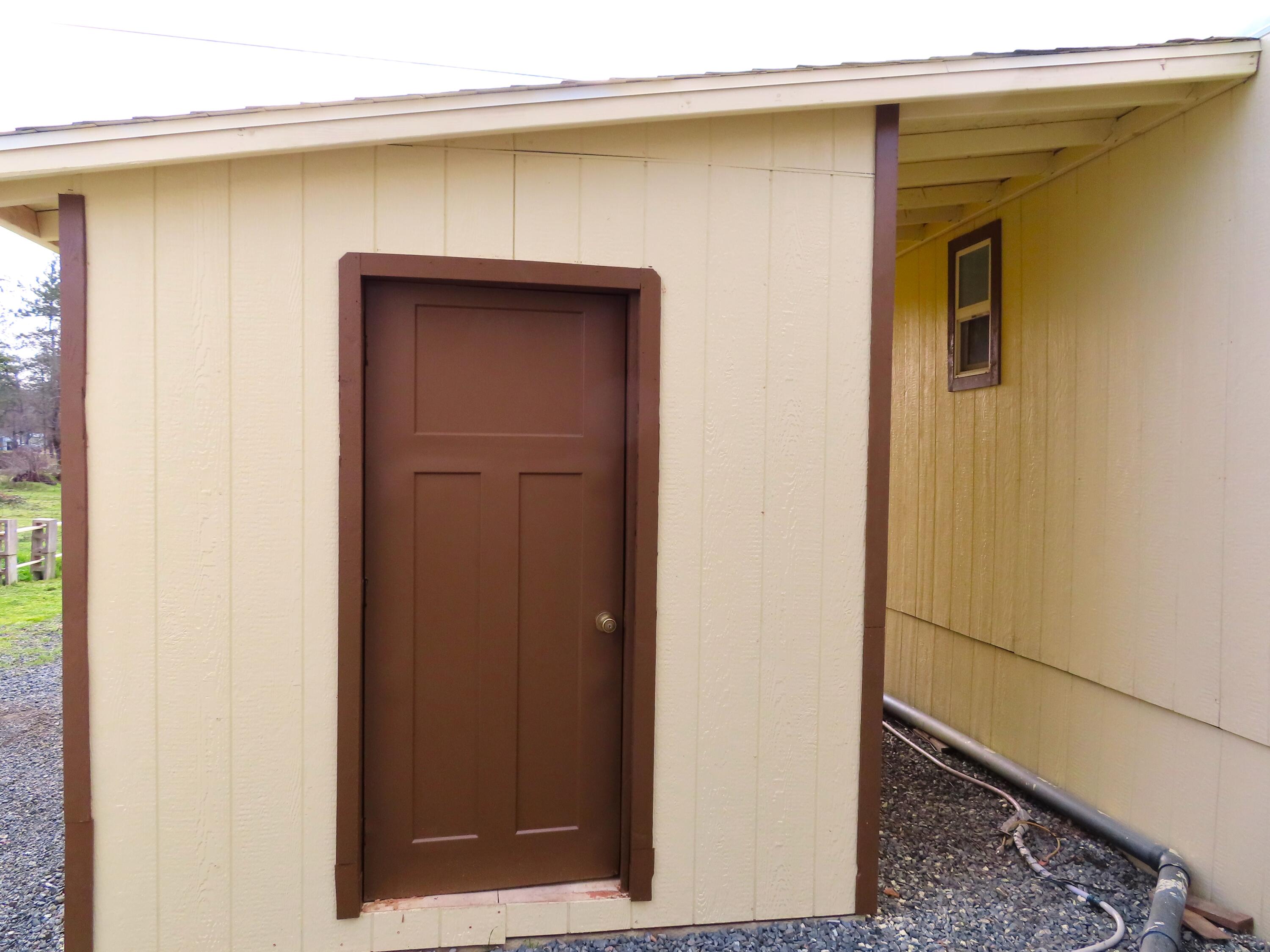 Attached storage shed