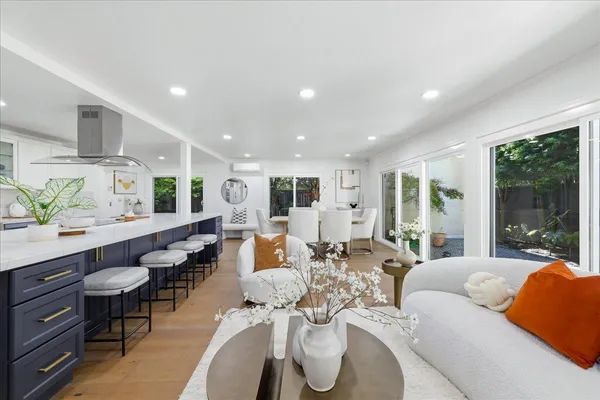 a very nice looking living room with furniture and a large window