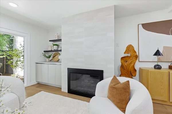 a kitchen with stainless steel appliances granite countertop a sink and a large window