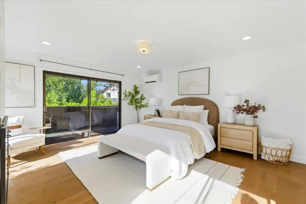a living room with furniture a table and a large window