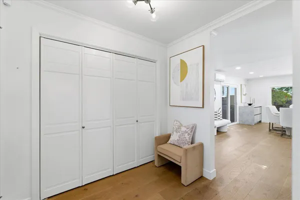 a bed room with two beds and a chair