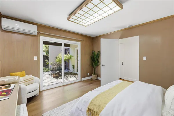 a spacious bedroom with a large bed and a fireplace