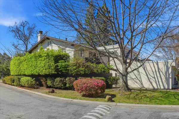 a kitchen with stainless steel appliances a sink and a refrigerator