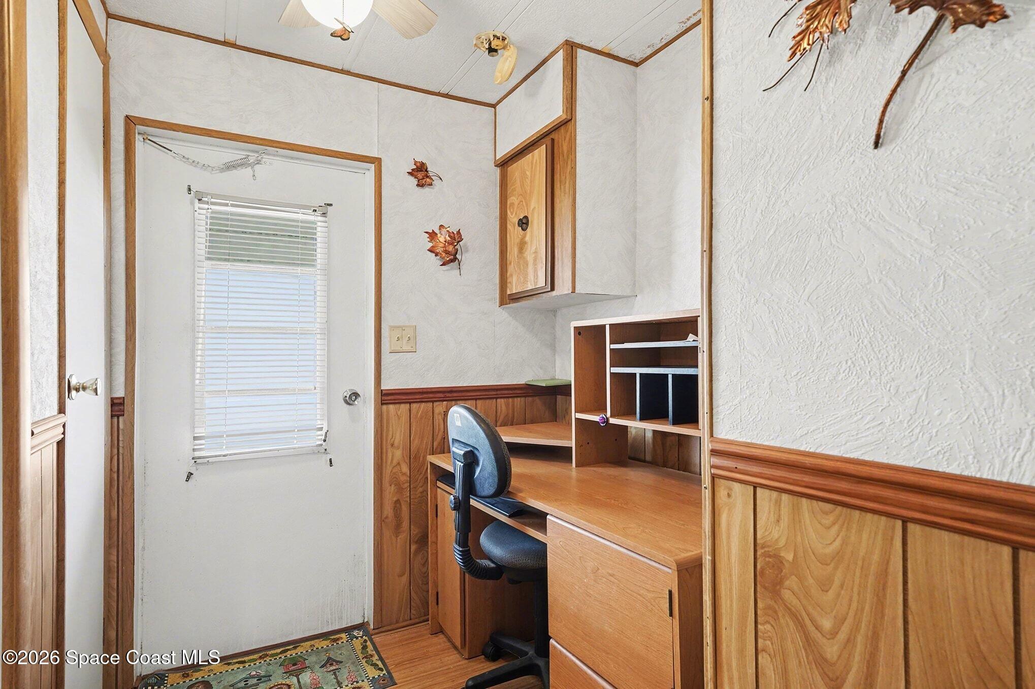 1740 Coco Plum Street Northeast Palm Bay, FL 32905 - Photo 15 of 33 a view of kitchen with wooden floor and cabinets