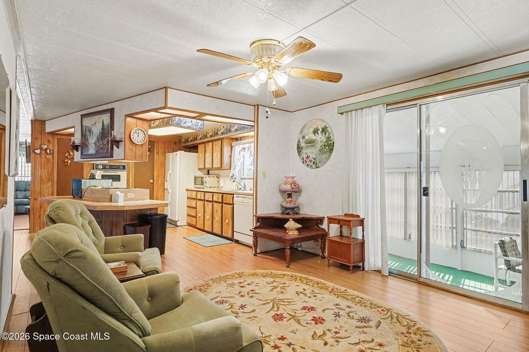 1740 Coco Plum Street Northeast Palm Bay, FL 32905 - Photo 9 of 33 a living room with furniture and a large window