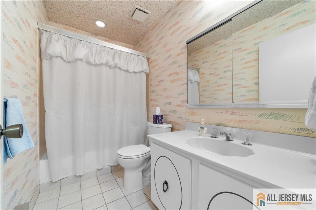 460A Delair Road, Unit A Monroe Township, NJ 08831 - Photo 16 of 29 a bathroom with a sink a toilet and shower