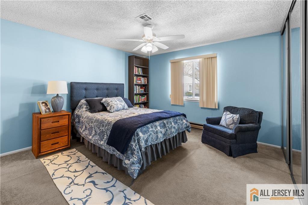 460A Delair Road, Unit A Monroe Township, NJ 08831 - Photo 20 of 29 a bedroom with a bed and a couch