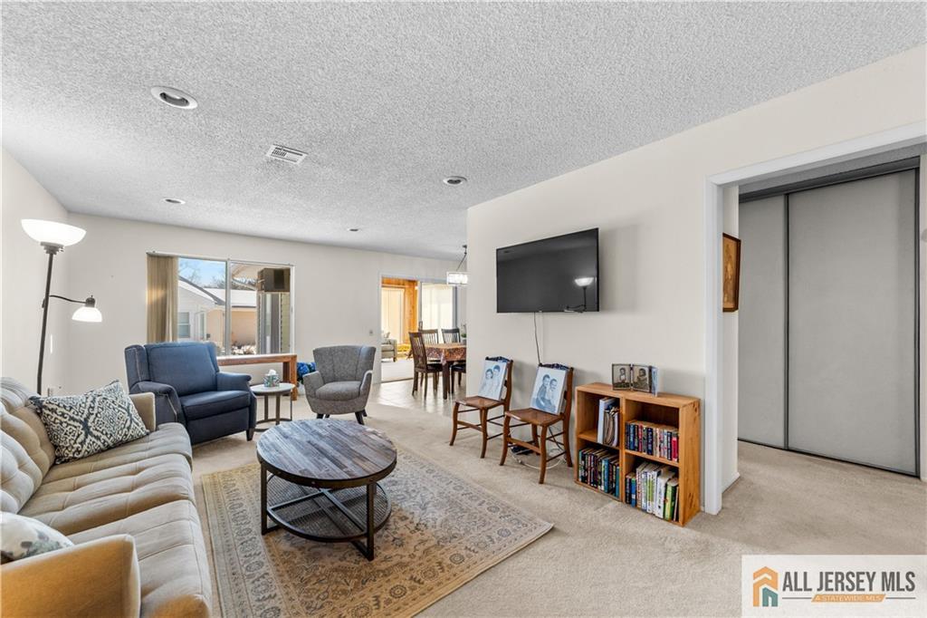 460A Delair Road, Unit A Monroe Township, NJ 08831 - Photo 5 of 29 a living room with furniture and a flat screen tv