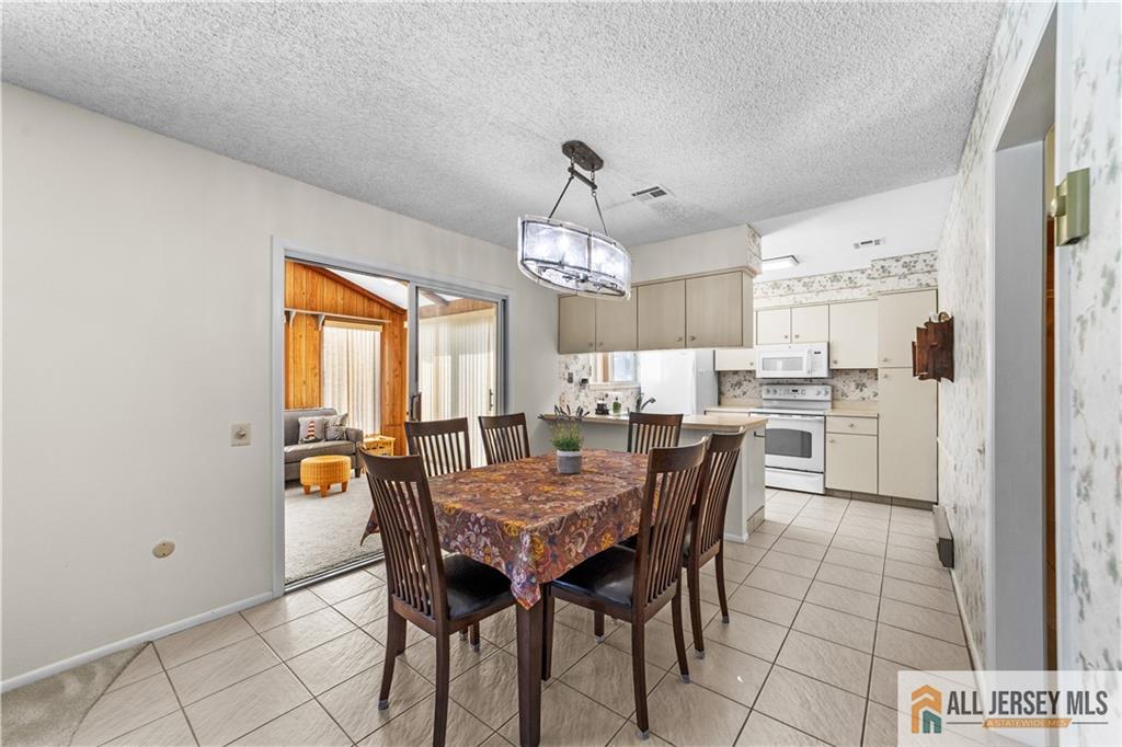 460A Delair Road, Unit A Monroe Township, NJ 08831 - Photo 8 of 29 a view of a dining room with furniture
