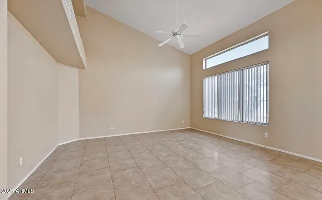 a view of an empty room with windows